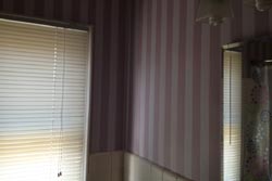 Bathroom walls with stripes.